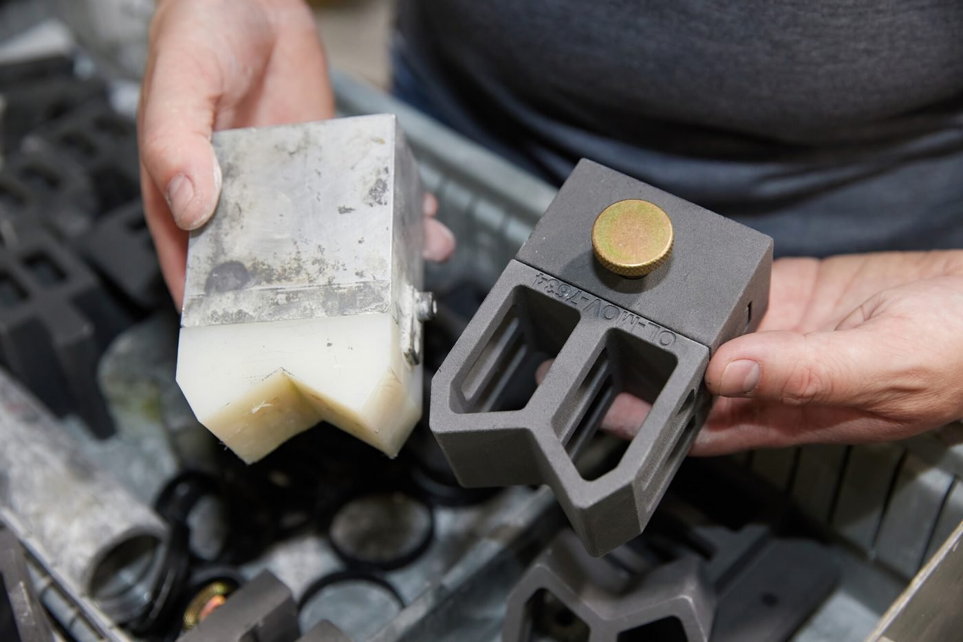 A worn original part next to its reverse engineered CAD model